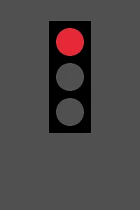 The stoplight with the top lamp bright red and the lower two a dull dark gray