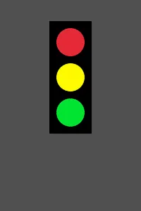 The stoplight with all three lamps lit bright red, yellow, and green at the same time